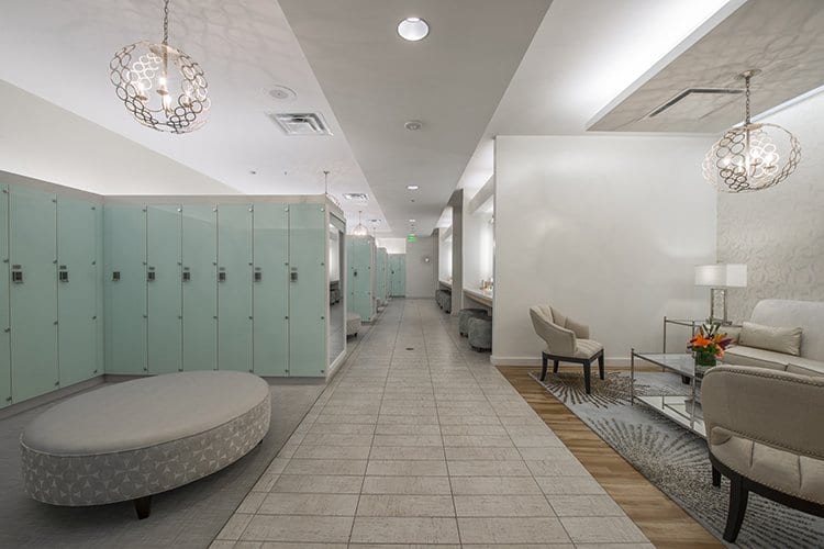 Cooper Fitness Center Womens Locker Room featuring glass lockers and grooming stations.